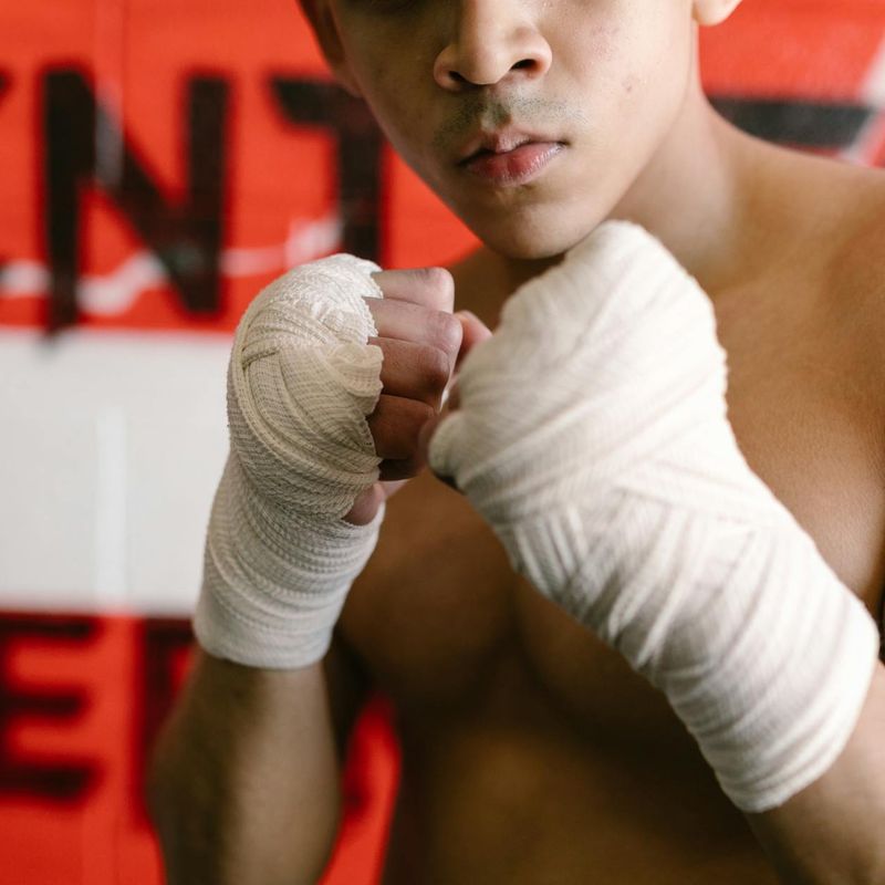 Close-up of a person's hands in a precise, focused position.